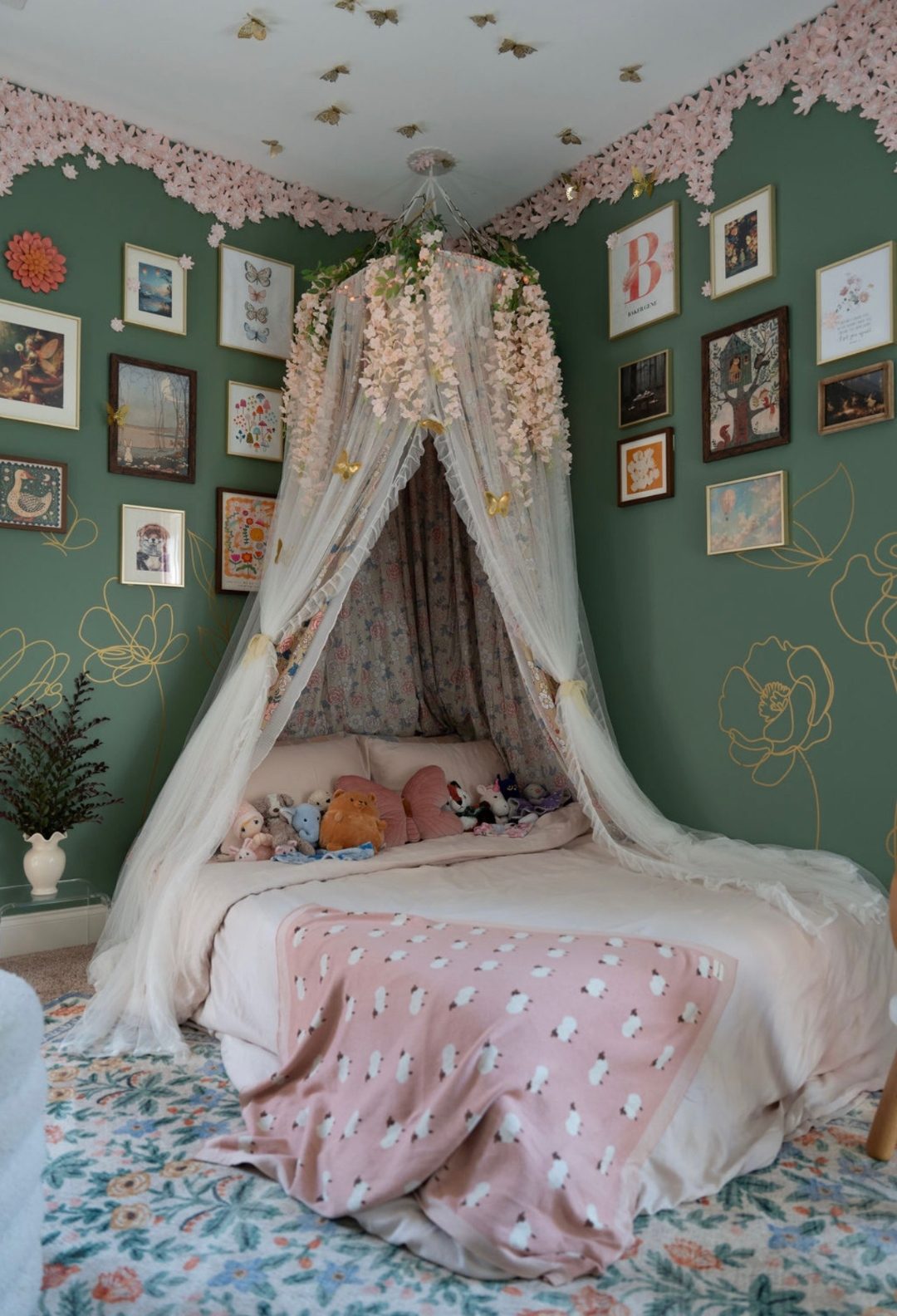 Woodland-themed children's room with canopy bed, forest mural, and warm lighting